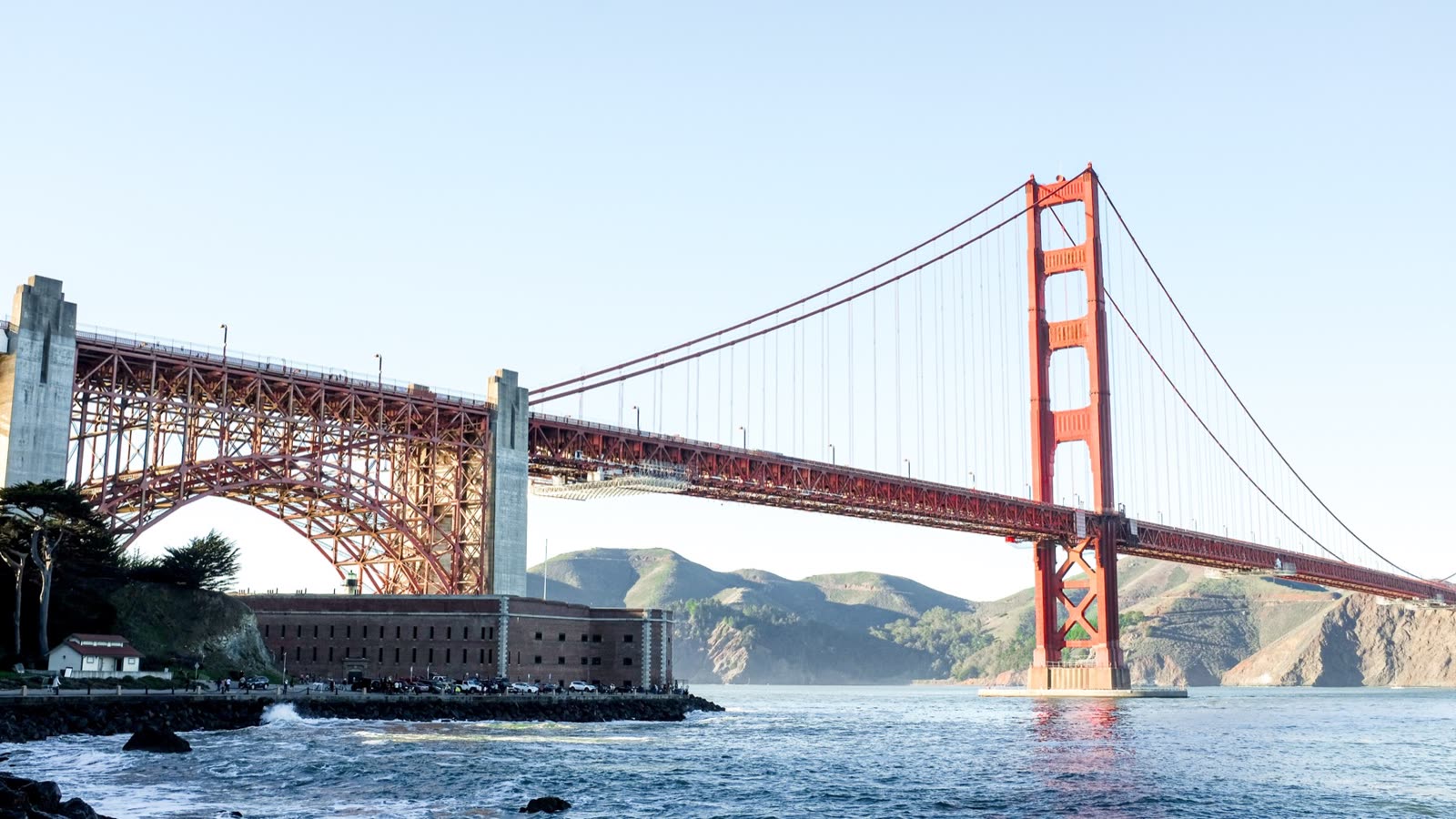 The Golden Gate Bridge seen from the San Francisco shoreline on a clear day.